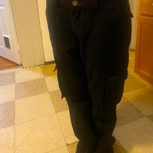 Some black baggy jeans with six pockets